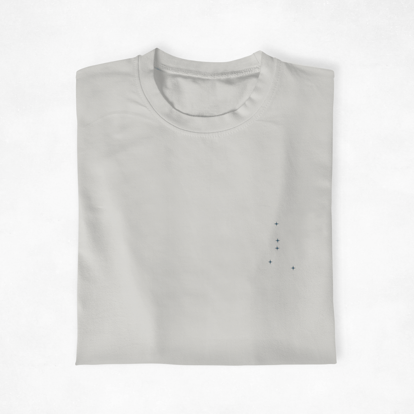 Folded Silver Cancer constellation t-shirt on a white background