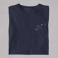 Folded  t-shirt with the Aquarius constellation design on a white background.