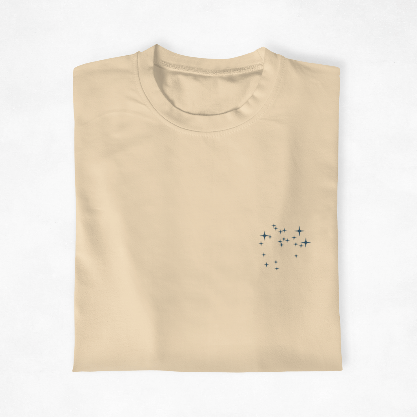 Folded  t-shirt with the Sagittarius constellation design on a white background.