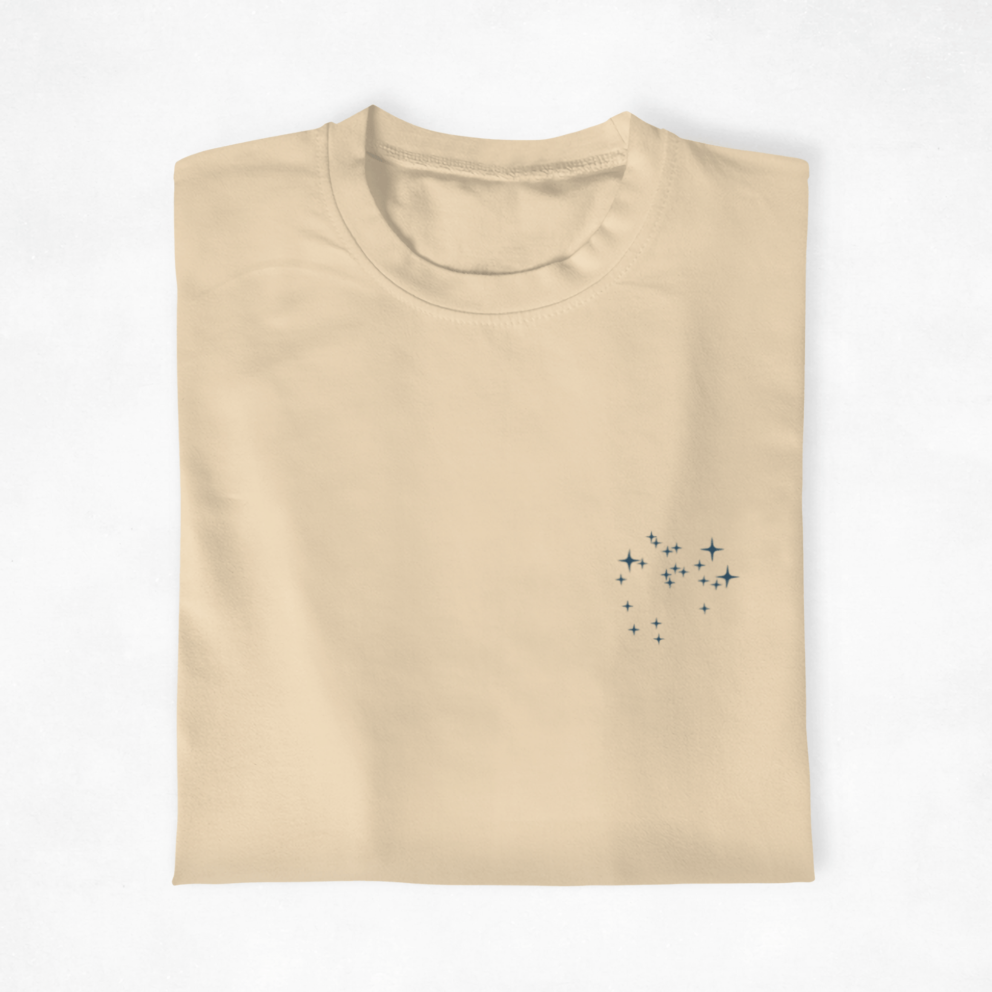 Folded  t-shirt with the Sagittarius constellation design on a white background.